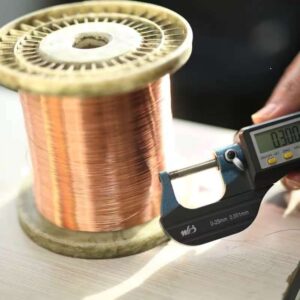 Fine wire drawing machine in operation, processing metal wires into thin, uniform strands.
