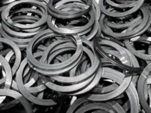 Stainless steel automotive snap ring for retaining bearing in transmission system